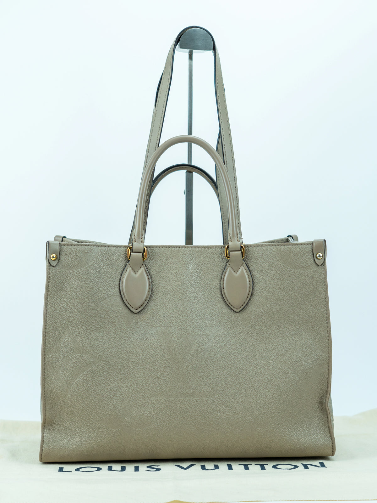 Louis Vuitton OnTheGo MM in pelle grigio tortora
