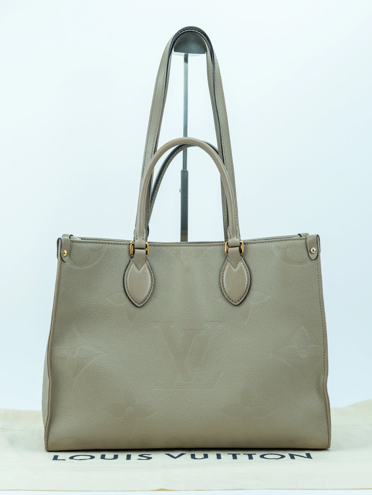 Louis Vuitton OnTheGo MM in pelle grigio tortora